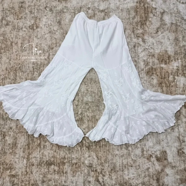 Hand embroidered Lucknowi Chikankari jalebi cut palazzo for women featuring floral motifs and a layered flared hem