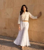 Hand embroidered Lucknowi Chikankari jalebi cut palazzo for women featuring floral motifs and a layered flared hem