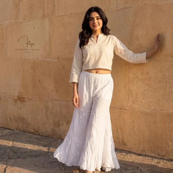Hand embroidered Lucknowi Chikankari jalebi cut palazzo for women featuring floral motifs and a layered flared hem