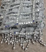 Women's dupatta featuring handcrafted mirror work lace in a geometric square pattern with silver tassel detailing