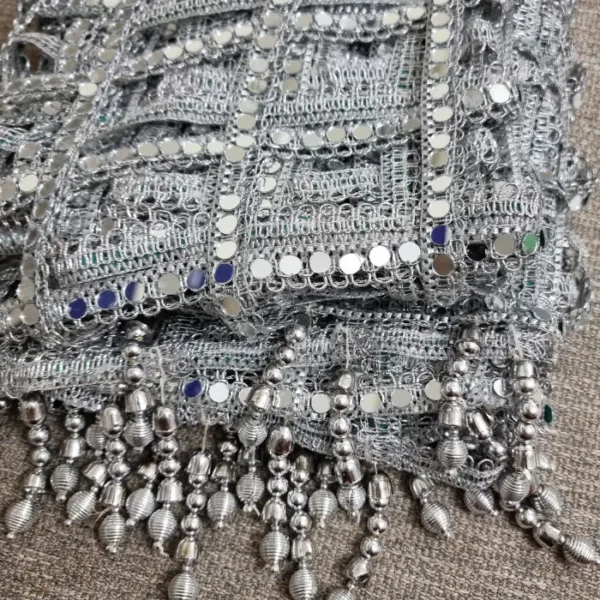 Women's dupatta featuring handcrafted mirror work lace in a geometric square pattern with silver tassel detailing
