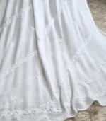 White georgette Lucknowi Chikankari dupatta with diagonal embroidery, floral bootis and embroidered vine detailing by Fiza Chikan Dubai