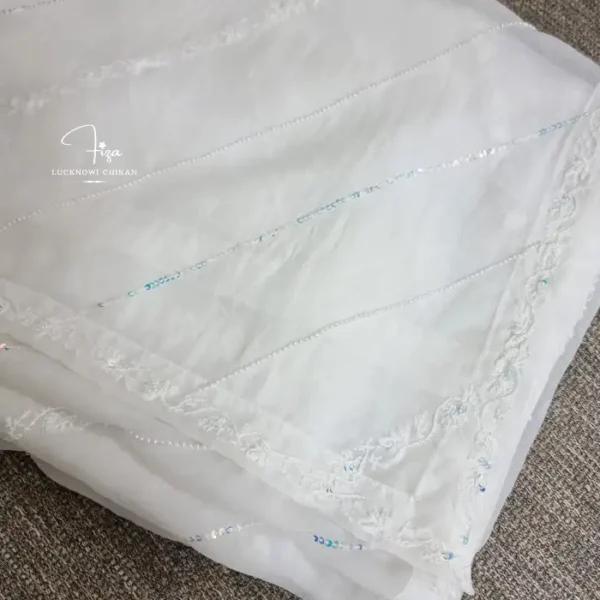 White organza Lucknowi Chikankari dupatta with diagonal embroidery lines, floral borders, sequins and beadwork by Fiza Chikan Dubai