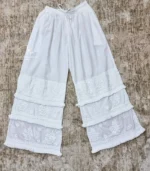 White Lucknowi Chikankari palazzo with layered embroidered panels, frill accents, and hand embroidery, available from Fiza Chikan Dubai, UAE.