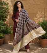 Shop a beige Ajrakh Modal Satin dupatta with deep blue and red motifs, finished with a lustrous Lagdi Patta border and tassels. Available in Dubai, UAE.