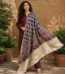 Shop a beige Ajrakh Modal Satin dupatta with deep blue and red motifs, finished with a lustrous Lagdi Patta border and tassels. Available in Dubai, UAE.