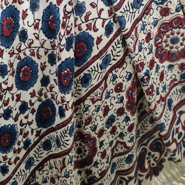 Shop a beige Ajrakh Modal Satin dupatta with deep blue and red motifs, finished with a lustrous Lagdi Patta border and tassels. Available in Dubai, UAE.