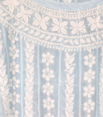 Powder blue Muslin co-ord set featuring white hand-embroidered Lucknowi Chikankari, an A-line flared top with bell sleeves, white lace detailing and matching wide-leg palazzo pants.