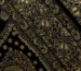 Intricate hand-embroidered Lucknowi Chikankari with embellishment on black fabric