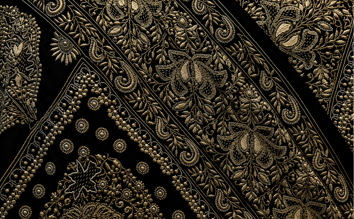 Intricate hand-embroidered Lucknowi Chikankari with embellishment on black fabric